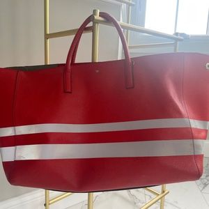 Anya Hindmarch feather weight orange reflective tote back retails $775!